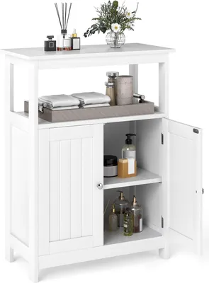 A white bathroom cabinet with two doors and open shelves, displaying various toiletries and decorative items.