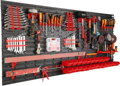 A well-organized tool wall with various tools and storage bins.