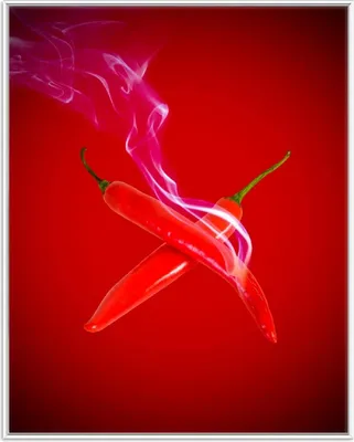Produktbild von Wallario Wandbild Rauchende Chili-Schoten im Duo vor rotem Hintergrund, Größe: 40,30 x 50,30 cm, Poster mit weißem Aluminiumrahmen