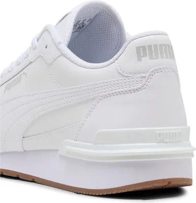 A close-up view of the heel and side of a white Puma sneaker.