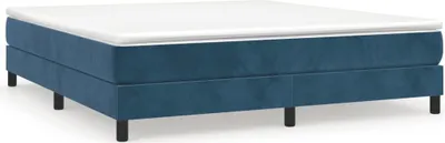 A dark blue box spring bed frame with a white mattress topper, shown from a side-angle on a white background.