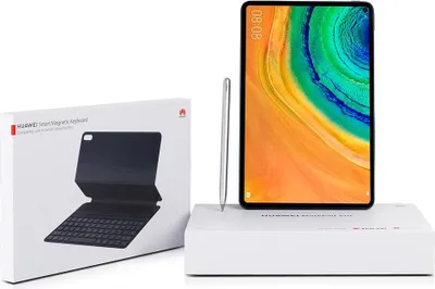 A Huawei MatePad Pro tablet, stylus, and keyboard case are displayed on a white surface, with packaging for the keyboard case visible.