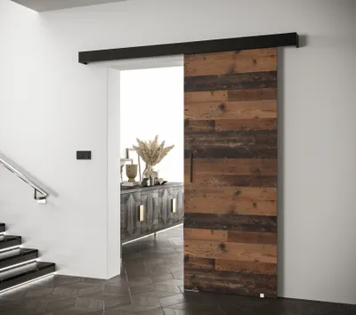 A sliding door in a hallway next to a staircase.