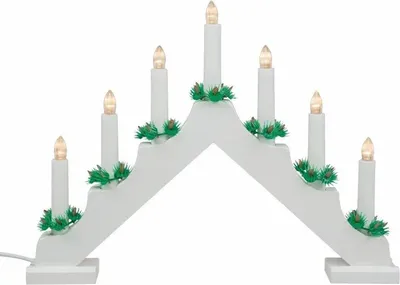 A white wooden advent candle holder with seven LED candle lights and green pine garland decorations.