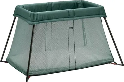 A BABYBJÖRN travel crib in green, shown from a front-side angle against a white background.