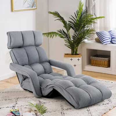 A gray floor chair is shown in a living room setting.