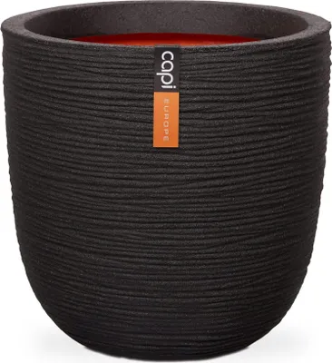 A black textured planter pot with an orange interior and a label on the side.