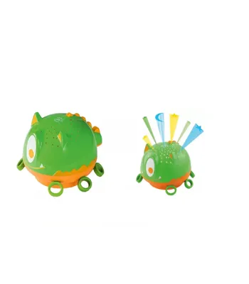 Two green and orange monster-shaped toys are displayed against a white background. The toy on the left has spikes on its back and rings on its feet. The toy on the right has colorful streamers emerging from its head and rings on its feet.