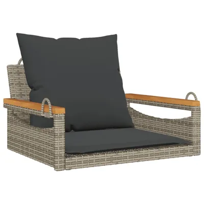 A hanging chair with cushions on a white background.