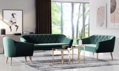 A modern living room setting with a green velvet sofa set and coffee tables.