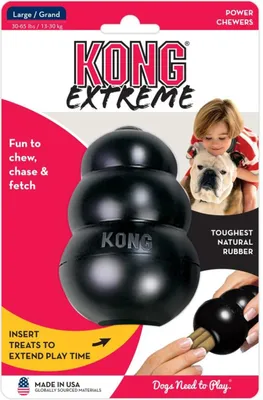 Packaging for a KONG Extreme dog toy, showing the toy, a child with a dog, and text describing its features.