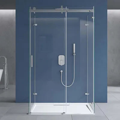 A modern shower cabin with a sliding door, installed in a bathroom with blue walls.