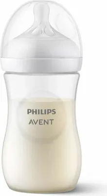 A clear studio shot of a baby bottle filled with milk.