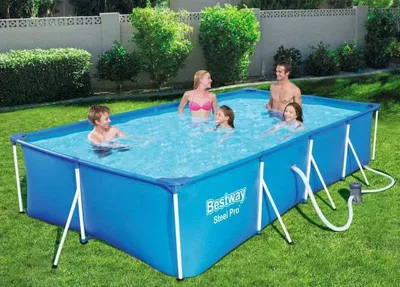 A family is enjoying a rectangular above-ground swimming pool in a backyard.