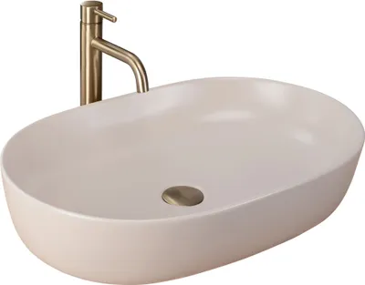 A beige matte washbasin with a gold faucet against a white background.