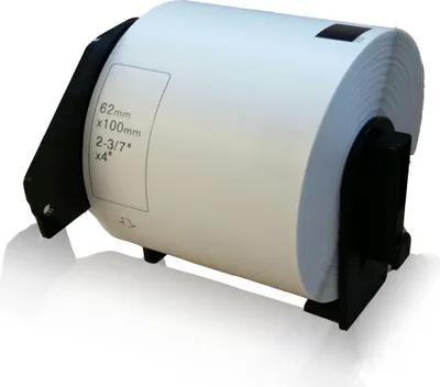 A roll of labels on a black holder, with some text printed on the label.