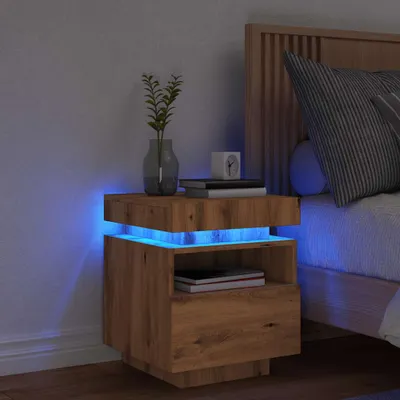 A wooden nightstand with blue LED lighting next to a bed.