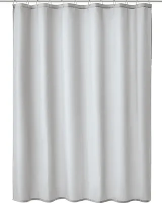 A plain white background with a grey and white shower curtain hanging.