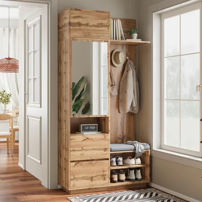 A compact wardrobe with a mirror, bench, and shoe storage in a hallway setting.