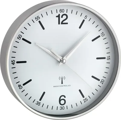 A close-up, studio shot of a white analog wall clock with a silver frame.