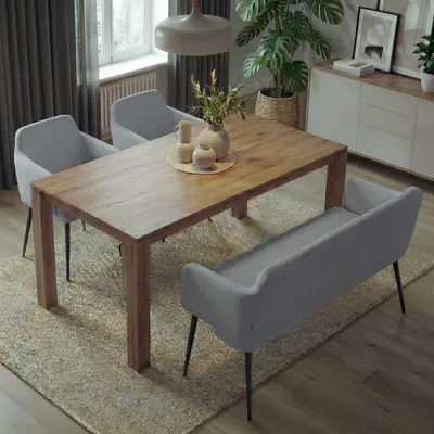 A dining set with chairs and a bench around a wooden table in a well-lit room.