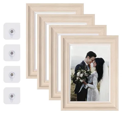 Image de Omgoods - Ensemble de 4 cadres photo, dimensions 17,8 x 23 cm, couleur blanche, pour accrocher au mur ou poser sur une table