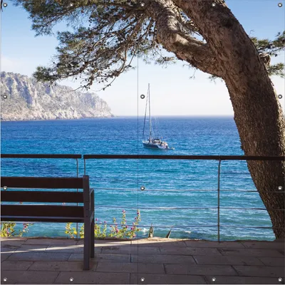 Produktbild von Wallario Outdoor-Poster für Garten oder Balkon, Motiv Einsame Bank am Meer - Spanien im Sommer, in ca. 180 x 180 cm