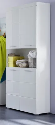 A white cabinet with multiple drawers and cabinets, in a room setting.