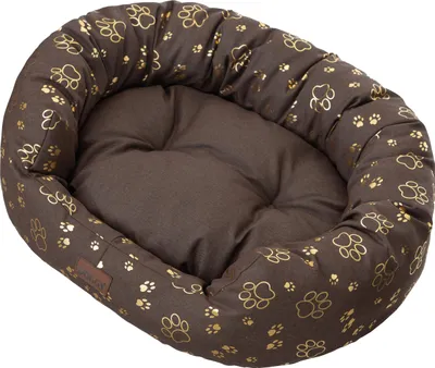 A brown oval dog bed with a gold paw print pattern.