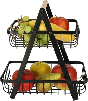 A two-tiered fruit basket filled with various fruits.