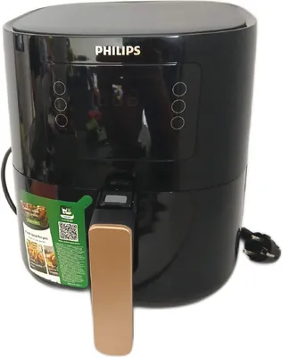 A black Philips air fryer with a gold handle is shown against a white background.