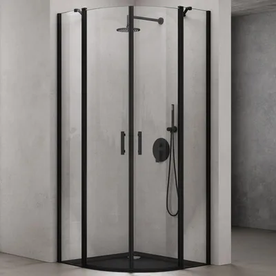 A modern black corner shower cabin with a curved glass door, installed in a bathroom with concrete-like walls.