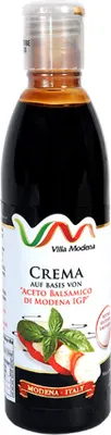 A bottle of balsamic glaze on a white background.