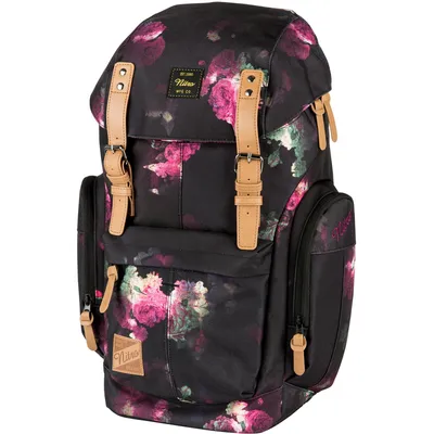 A black backpack with a floral pattern, featuring tan leather accents.
