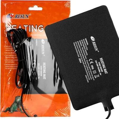 A product packaging with a heating mat partially visible.