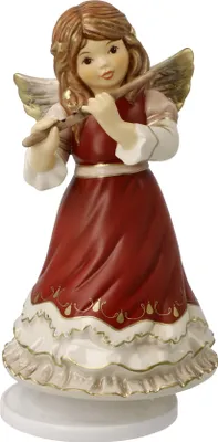 A ceramic angel figurine playing a flute, set against a white background.