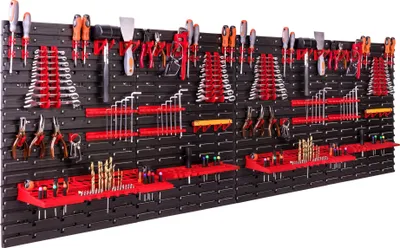 A wall-mounted tool organizer filled with various tools.