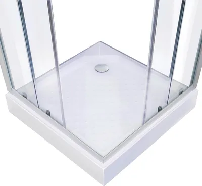 Close-up view of the corner of a shower cabin with glass doors and a textured shower tray.