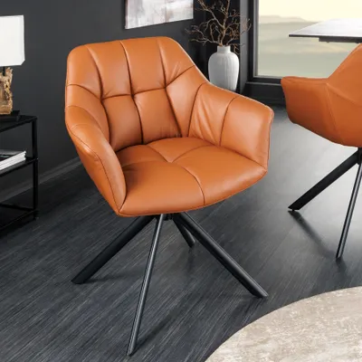 A brown leather swivel chair with a black metal base in a modern dining room setting.