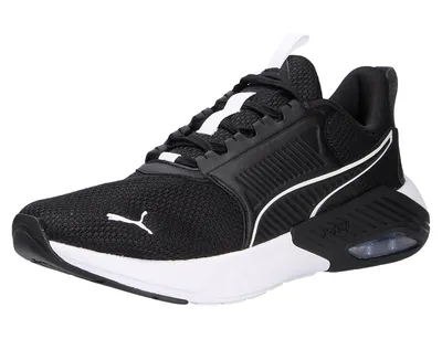 A black Puma running shoe with white accents is shown against a white background.