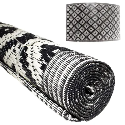 A rolled-up mat with a diamond pattern shown in a close-up view.