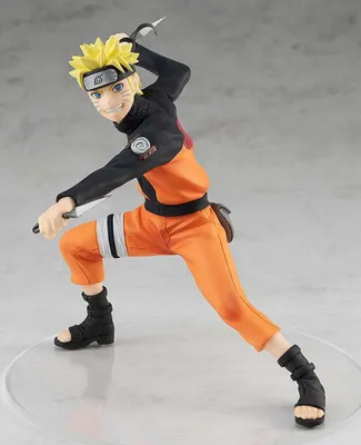 A statue of Naruto Uzumaki in a dynamic pose, holding kunai knives.