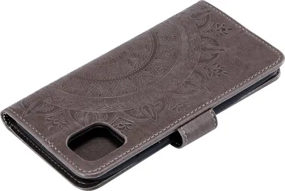A gray flip case for a smartphone with a mandala pattern embossed on the cover.