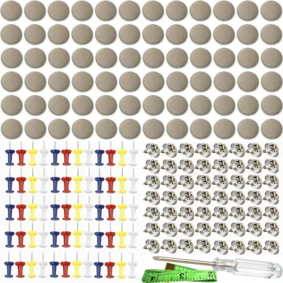 A collection of sewing and repair supplies, including fabric-covered buttons, push pins, snap fasteners, a measuring tape, and a screwdriver.
