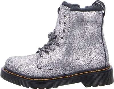 A side view of a silver Dr. Martens boot.
