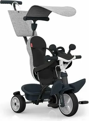 A studio shot of a baby tricycle.