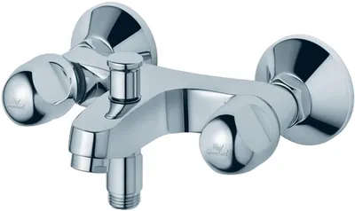 A chrome-finished bathroom faucet with two handles and a spout.