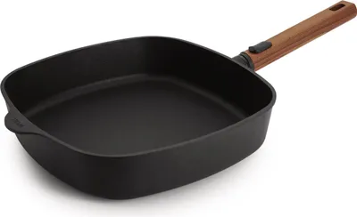 A square grill pan with a wooden handle is shown from a slightly elevated side angle on a white background.