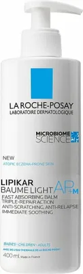 A white bottle of La Roche-Posay Lipikar Baume Light AP+M body lotion with a pump dispenser.