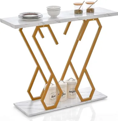 A console table with a marble-look top and gold metal legs, decorated with canisters and plates.